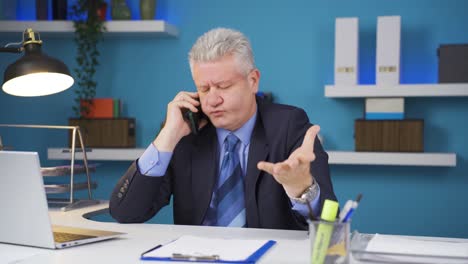 Stressed-talking-businessman-on-the-phone.